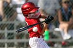 Baseball player hitting the ball